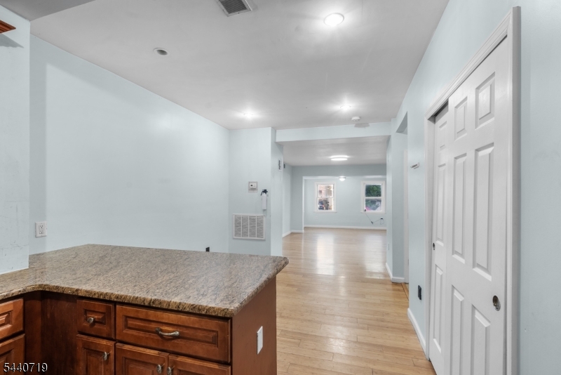 136 Smith Street Elizabeth, NJ 07201 - Photo 13 of 38 a view of a hallway with a kitchen