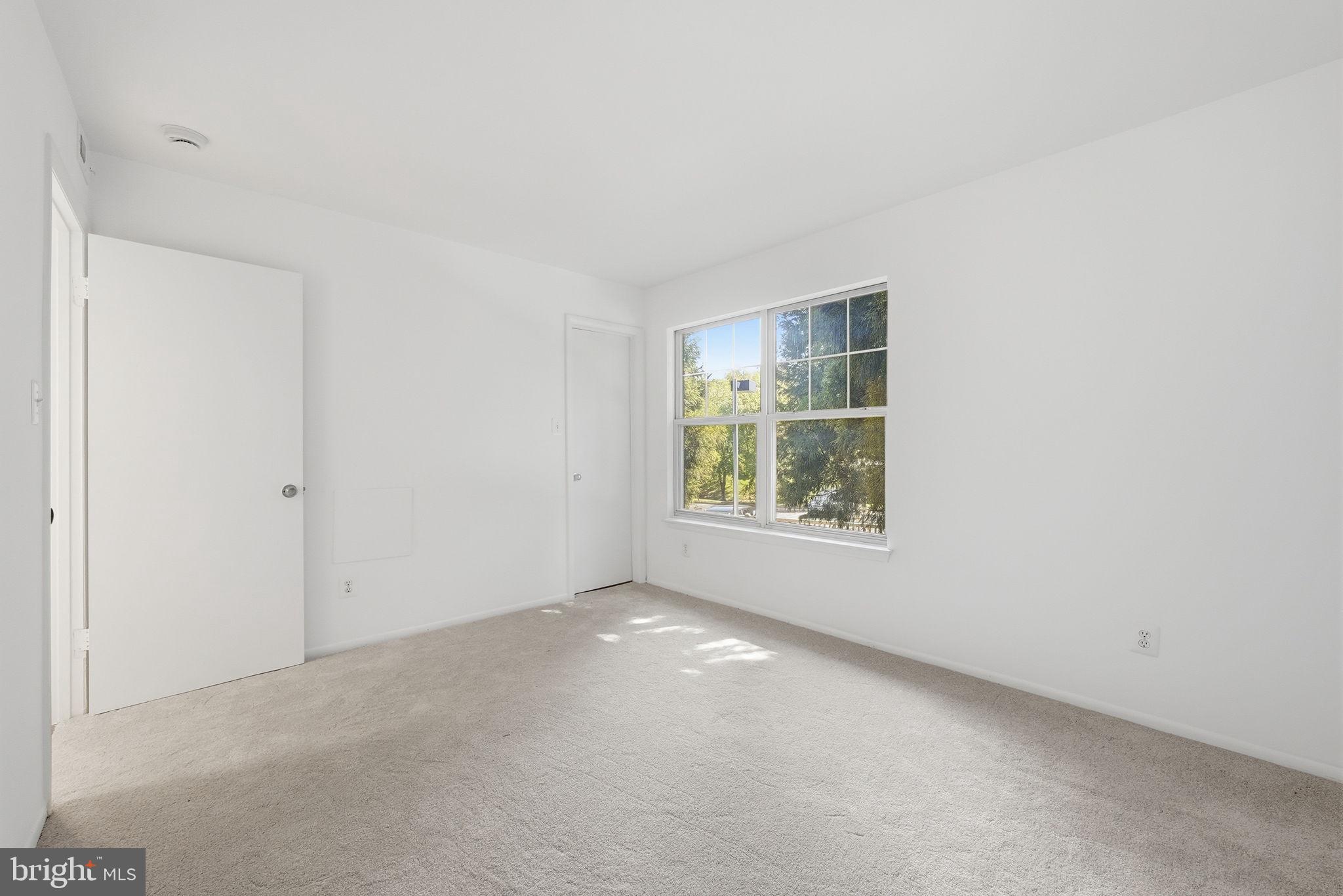 1703 Ascot Way, Unit D Reston, VA 20190 - Photo 14 of 21 an empty room with windows
