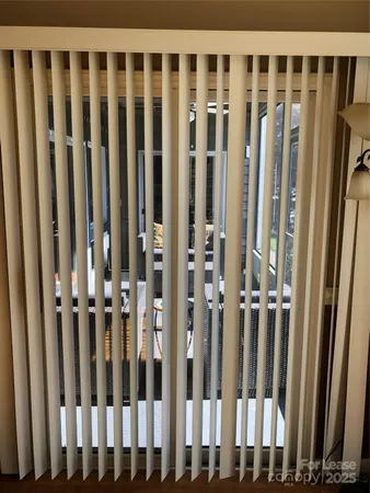 a view of a porch with wooden fence