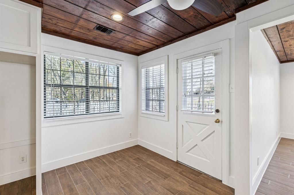209 McMillen Road Lucas, TX 75002 - Photo 13 of 38 a view of an empty room with wooden floor and a window