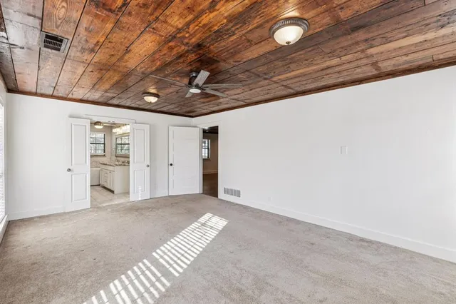 a view of an empty room with a windows