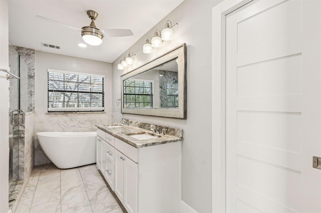209 McMillen Road Lucas, TX 75002 - Photo 19 of 38 a bathroom with a tub sink and a window