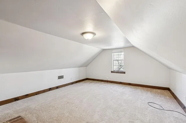 a view of a yard with a large tree