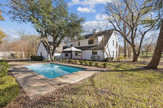 a view of park with large trees
