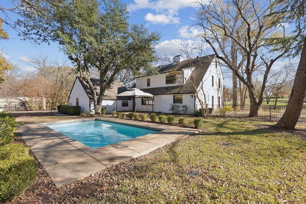 209 McMillen Road Lucas, TX 75002 - Photo 37 of 38 a view of a white house with a yard covered with snow in front of house