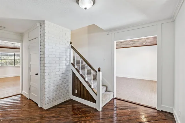 a view of an entryway with wooden floor