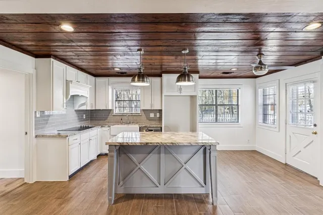 a kitchen with a stove and cabinets