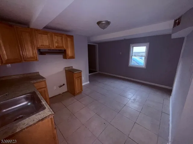 a kitchen with furniture and window