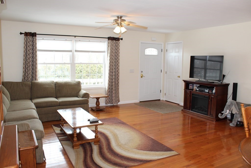 78 Point Grove Road Southwick, MA 01077 - Photo 8 of 33 a living room with furniture fireplace and a window