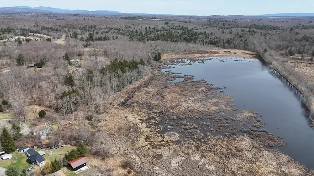 a view of a lake with beach and ocean