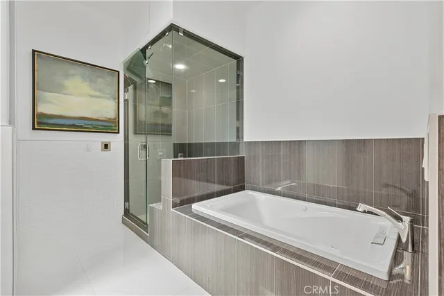 a bathroom with a tub and shower