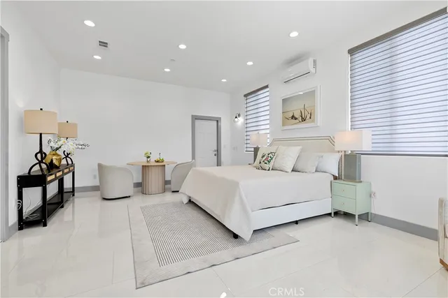 a bedroom with a bed and a view of bedroom