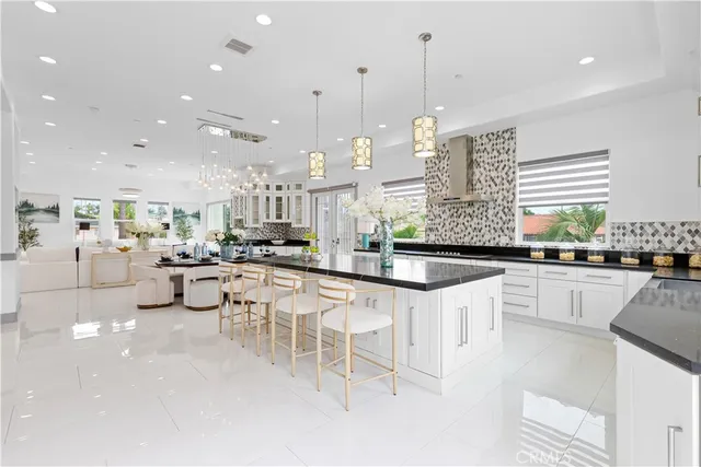 a kitchen with lots of counter top space and appliances