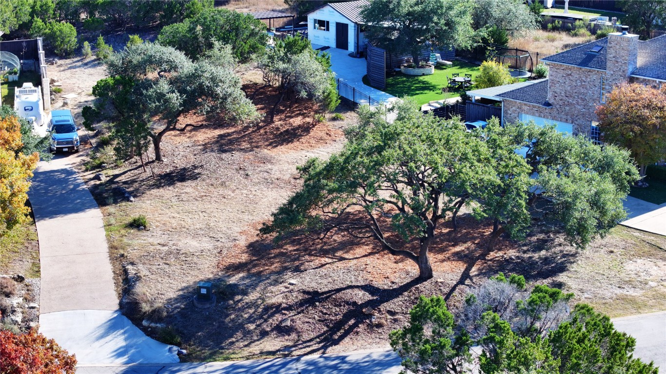 217 Lakefront Drive Point Venture, TX 78645 - Photo 6 of 13 a view of backyard with outdoor seating