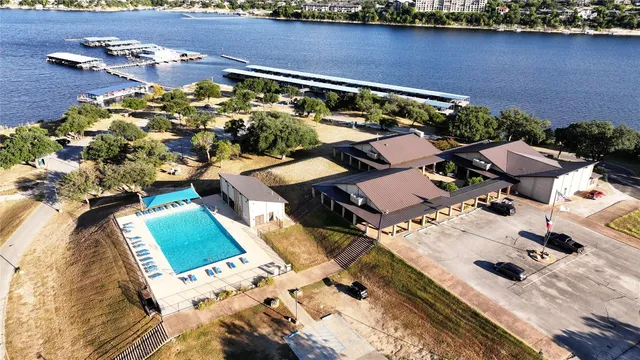 an aerial view of a house with a lake view
