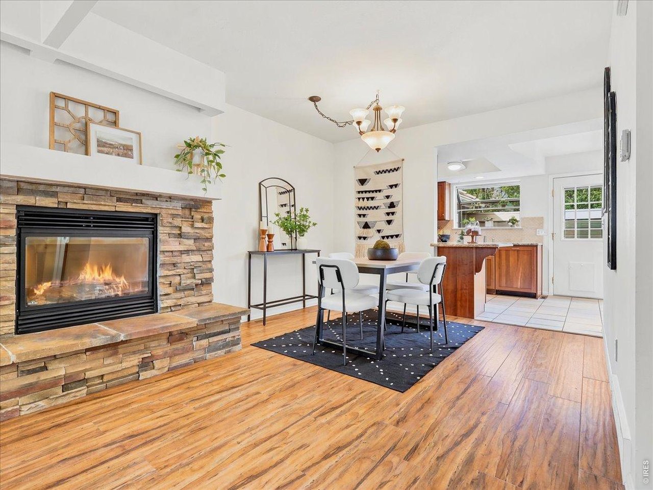 2115 Ranch Drive Denver, CO 80234 - Photo 10 of 50 Beautiful stacked stone fireplace and dining room space
