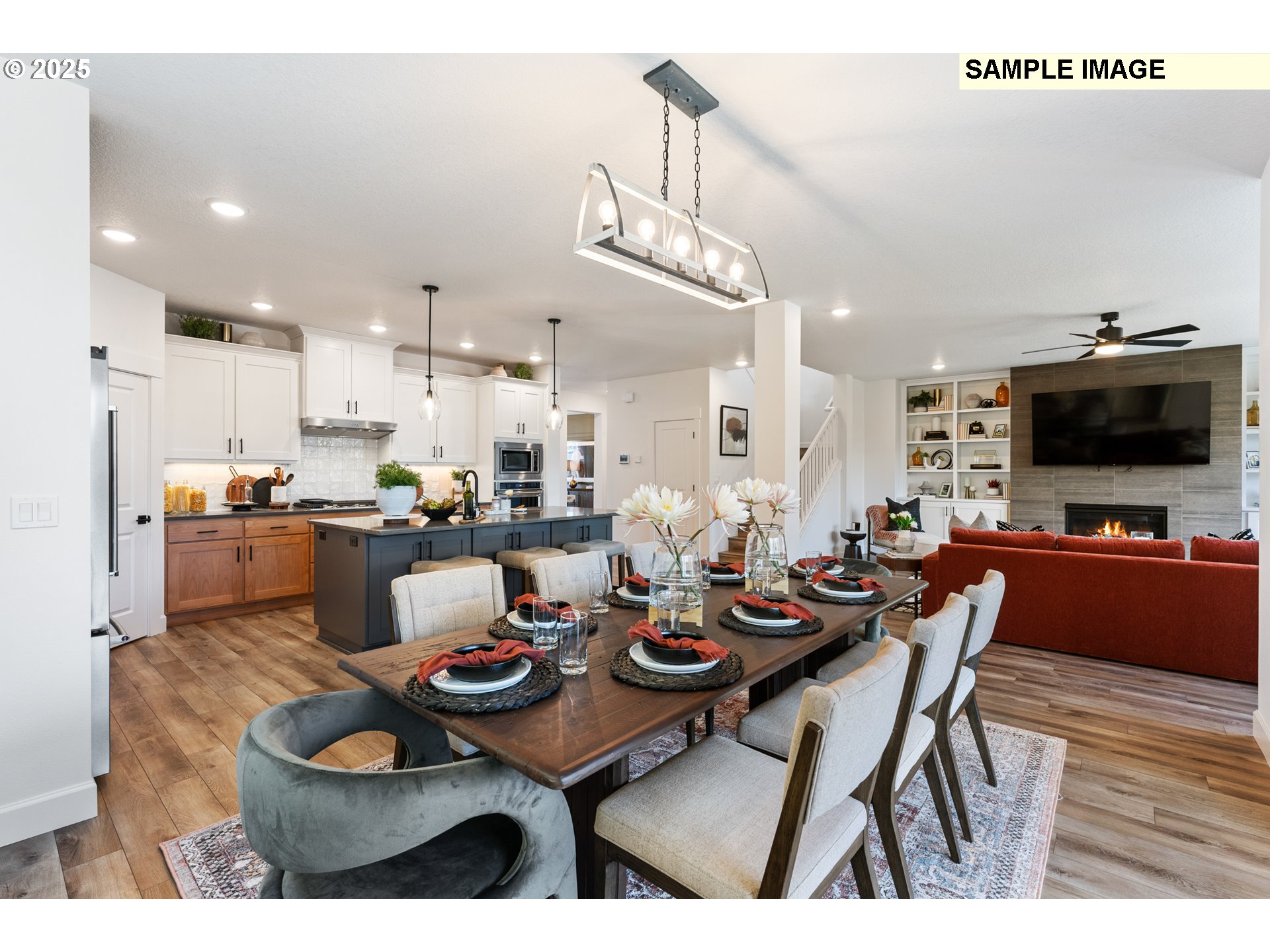 16502 Southwest Deer Terrace Durham, OR 97224 - Photo 15 of 42 a kitchen with stainless steel appliances kitchen island granite countertop a dining table chairs and view kitchen