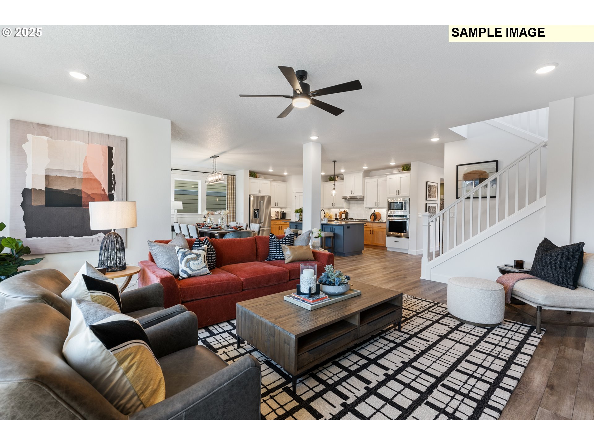 16502 Southwest Deer Terrace Durham, OR 97224 - Photo 20 of 42 a living room with furniture a rug and a chandelier