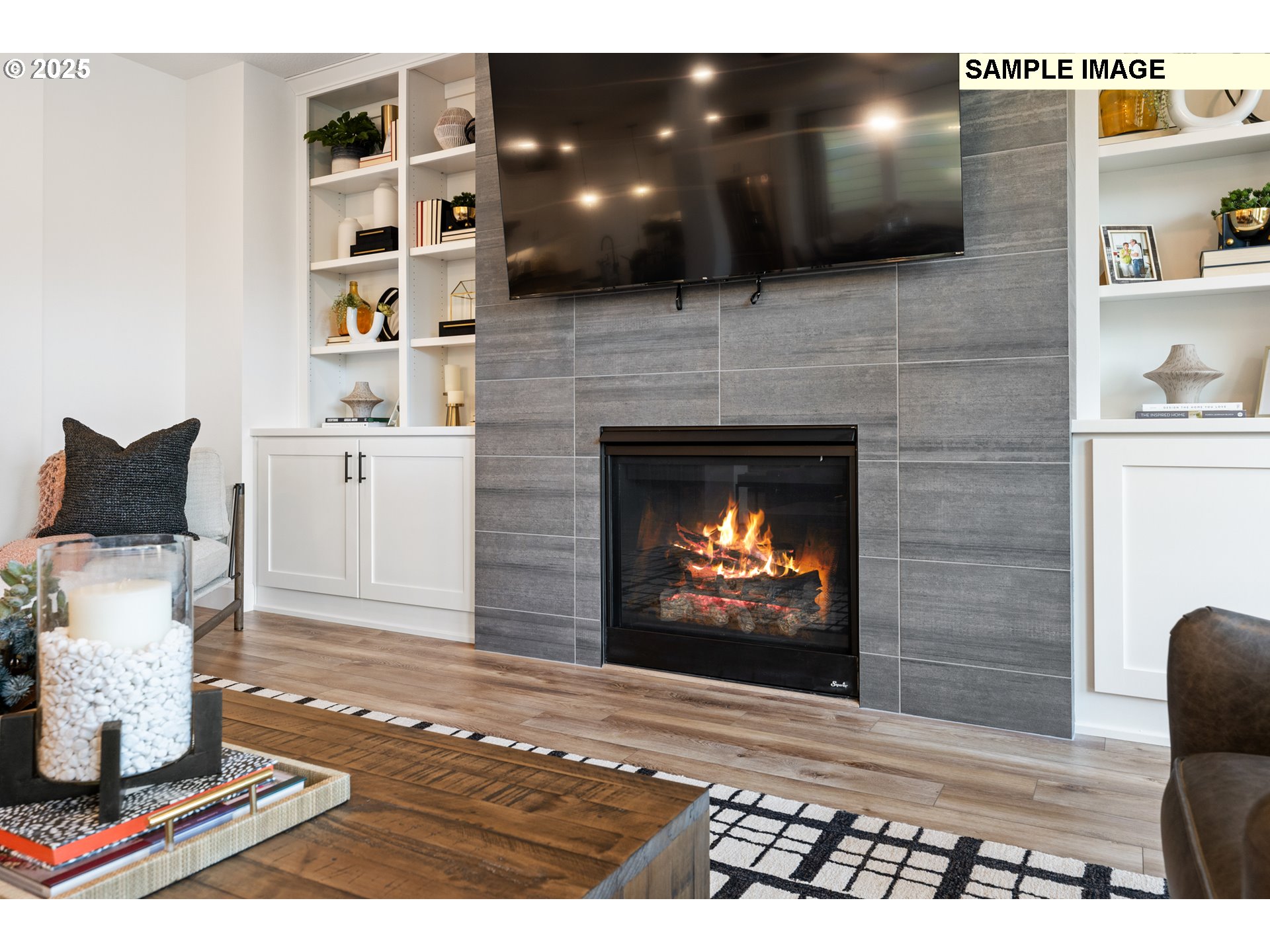 16502 Southwest Deer Terrace Durham, OR 97224 - Photo 21 of 42 a living room with a fireplace and a flat screen tv
