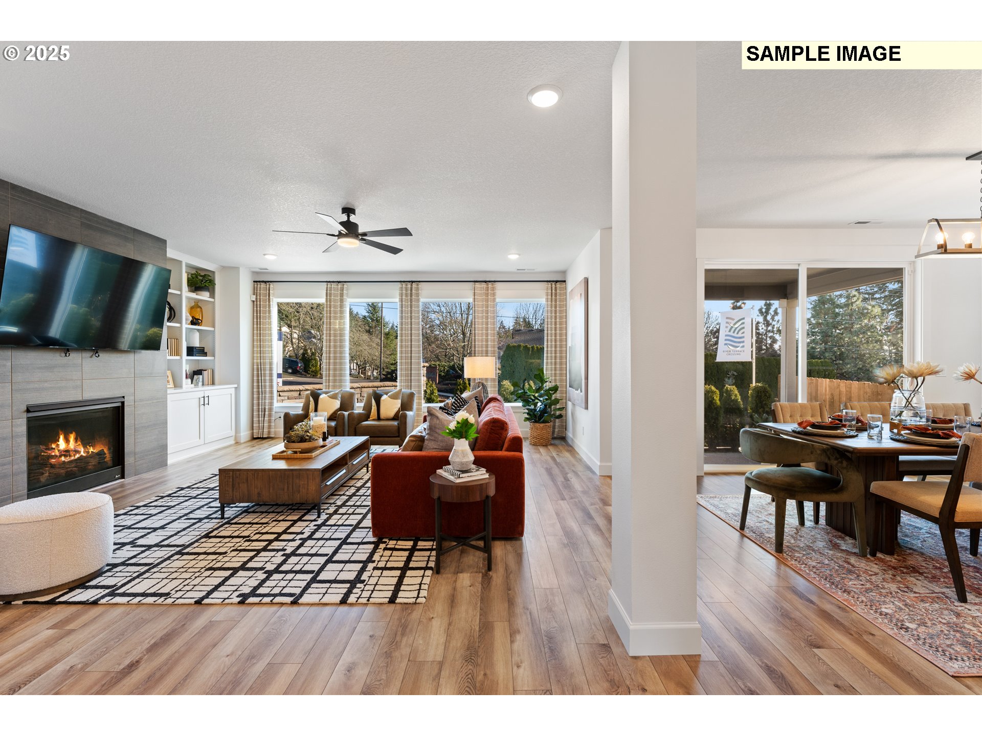 16502 Southwest Deer Terrace Durham, OR 97224 - Photo 23 of 42 a living room with furniture a fireplace and a large window
