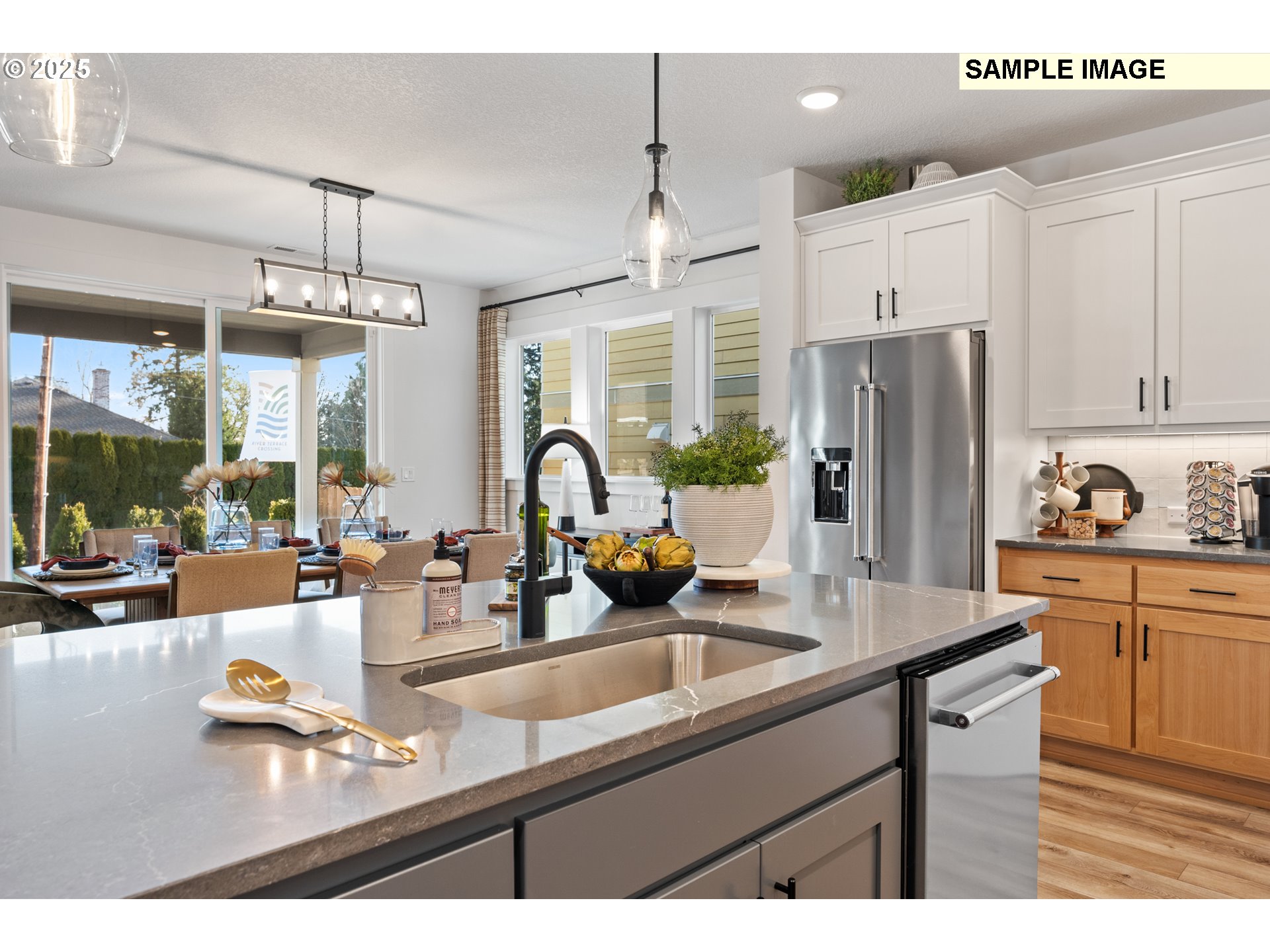 16502 Southwest Deer Terrace Durham, OR 97224 - Photo 24 of 42 a kitchen with stainless steel appliances granite countertop a sink refrigerator and cabinets