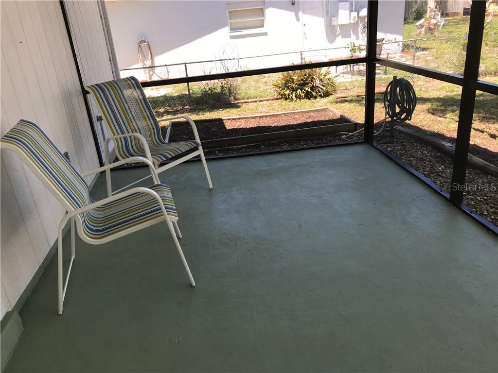 908 Royal Road Venice, FL 34293 - Photo 22 of 30 Peaceful lanai setting. Enjoy the squirrels and birds!