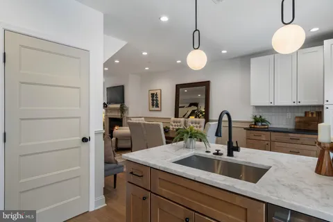 a kitchen with cabinets a sink and appliances