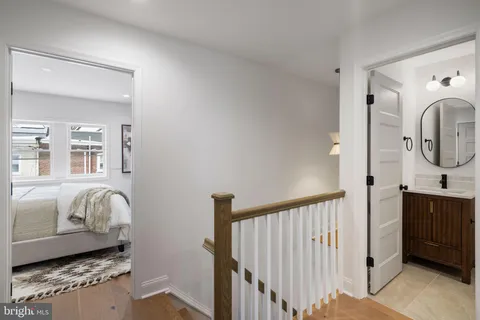 a view of a livingroom with furniture and staircase