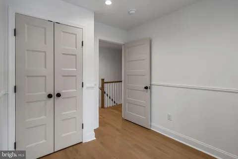 an empty room with wooden floor