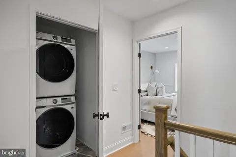 a view of a hallway with washer and dryer