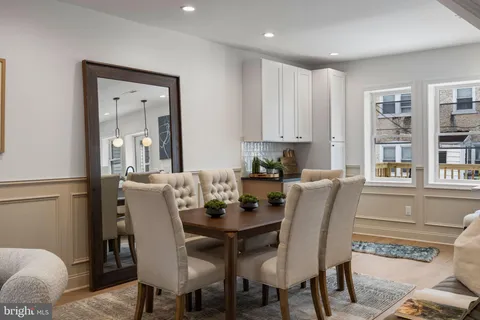 a view of a dining room with furniture and window