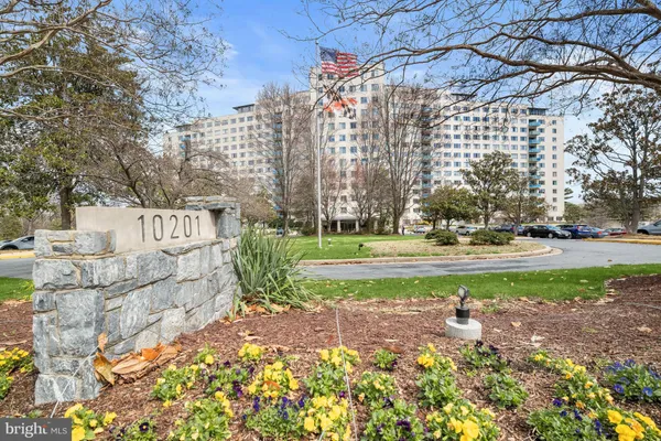 a view of a building with a yard