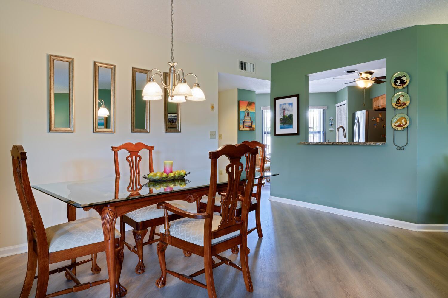 6030 Southeast Martinique Drive, Unit 102 Stuart, FL 34997 - Photo 10 of 31 a dining room with furniture and window