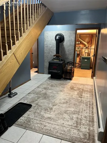 a bedroom with a bed with wooden floor