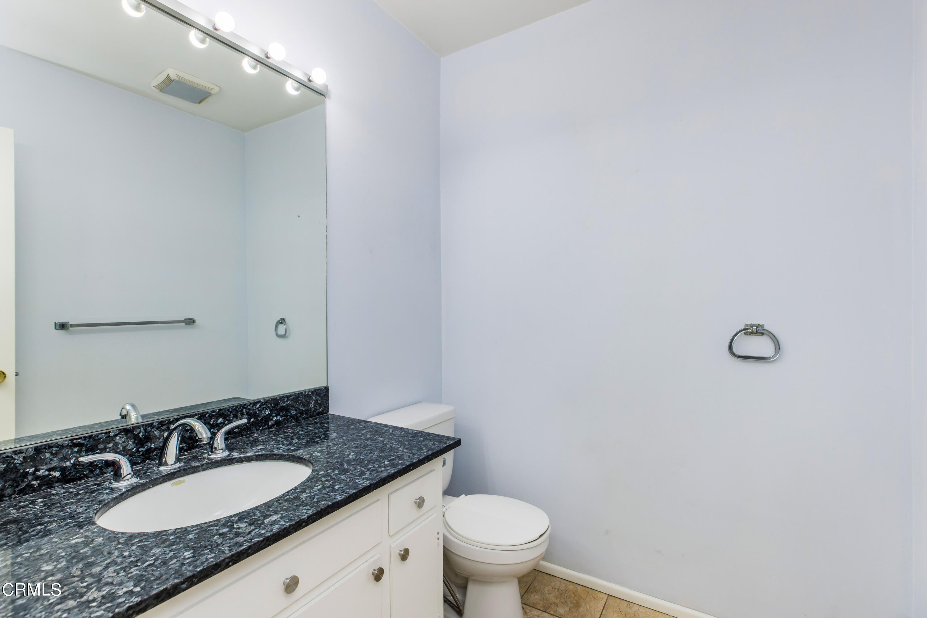 911 Arden Road Pasadena, CA 91106 - Photo 11 of 19 a bathroom with a granite countertop sink and a mirror