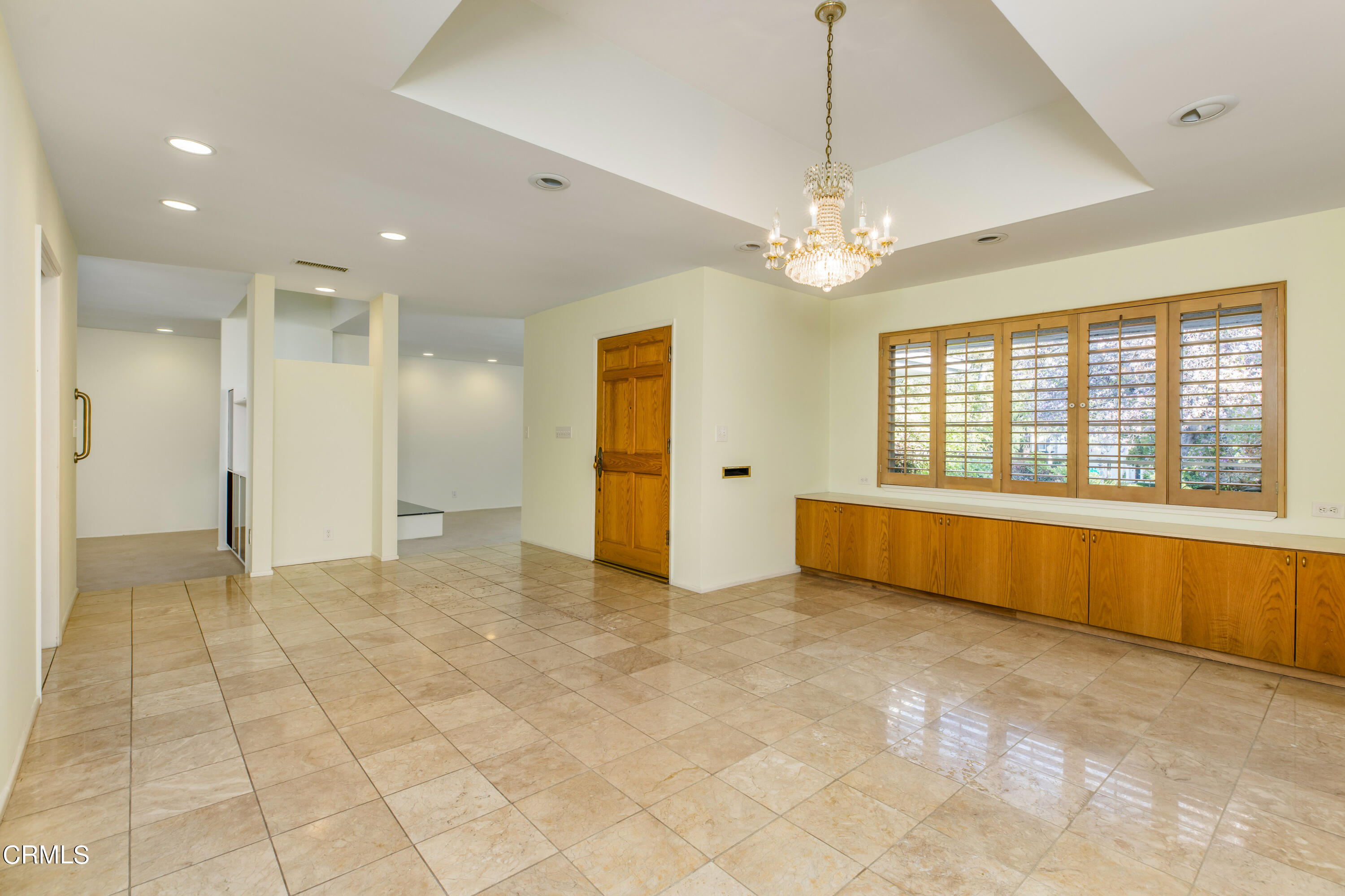 911 Arden Road Pasadena, CA 91106 - Photo 2 of 19 a view of an empty room with window and chandelier fan