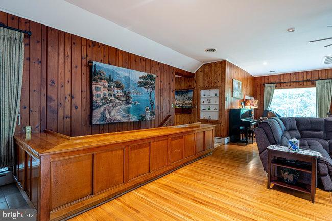 10246 Golf Course Road Fayetteville, PA 17222 - Photo 15 of 62 a living room with furniture a wooden floor and a window