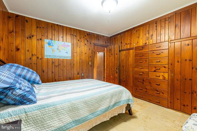 10246 Golf Course Road Fayetteville, PA 17222 - Photo 17 of 62 a bedroom with a bed and cabinet