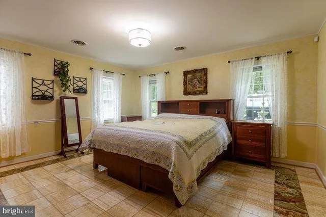 a balcony with furniture and large window