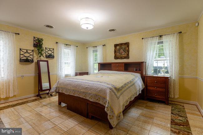 10246 Golf Course Road Fayetteville, PA 17222 - Photo 25 of 62 a bedroom with a bed and a window