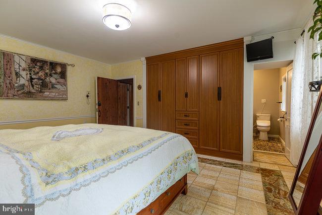 10246 Golf Course Road Fayetteville, PA 17222 - Photo 26 of 62 a bedroom with a bed and a dresser