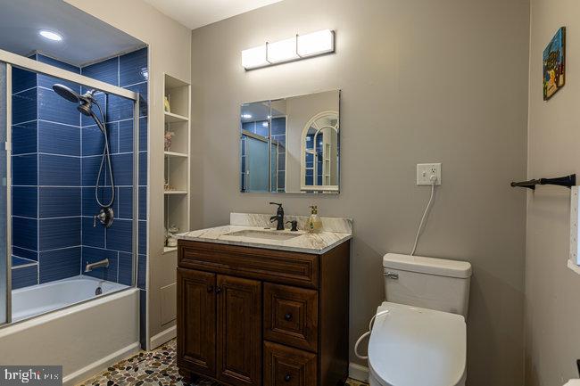 10246 Golf Course Road Fayetteville, PA 17222 - Photo 28 of 62 a bathroom with a toilet a sink and bathtub