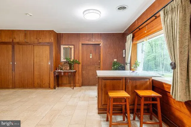 a large kitchen with stainless steel appliances granite countertop a sink and cabinets