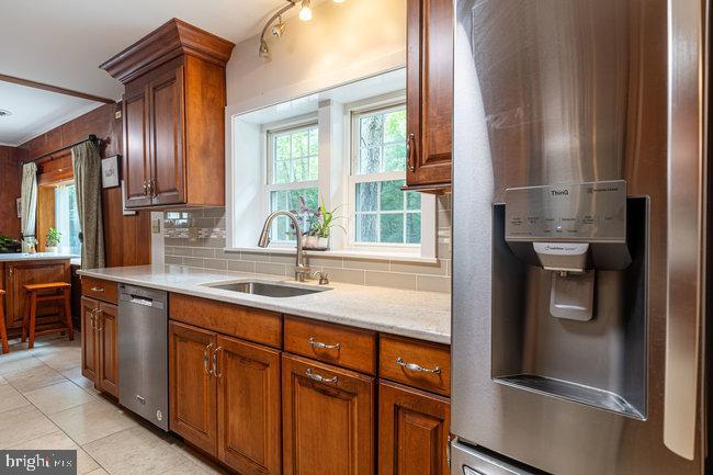 10246 Golf Course Road Fayetteville, PA 17222 - Photo 34 of 62 a kitchen with stainless steel appliances granite countertop a refrigerator and a sink