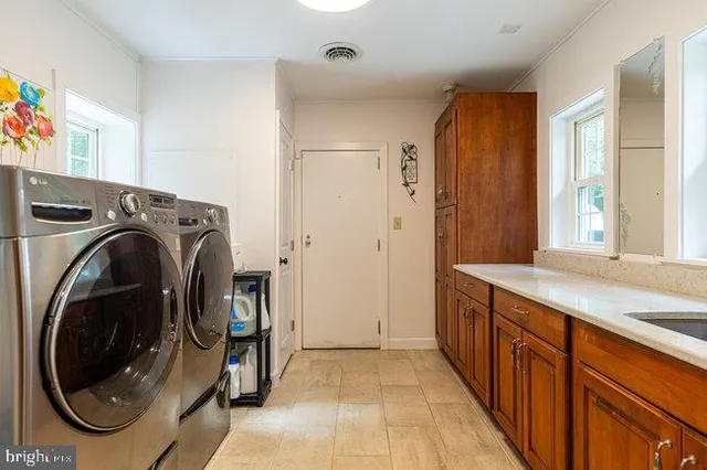 a living room with furniture and a chair