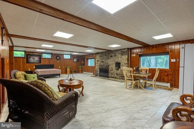 a living room with furniture and floor to ceiling windows