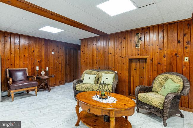 10246 Golf Course Road Fayetteville, PA 17222 - Photo 42 of 62 a living room with furniture and a chair