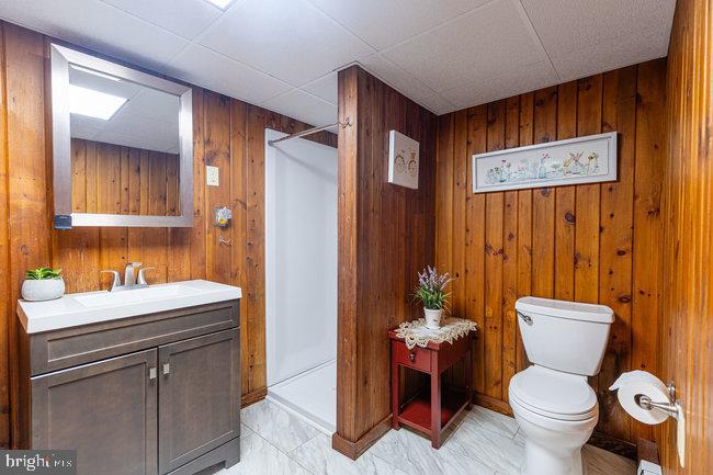 10246 Golf Course Road Fayetteville, PA 17222 - Photo 43 of 62 a bathroom with a toilet sink and mirror