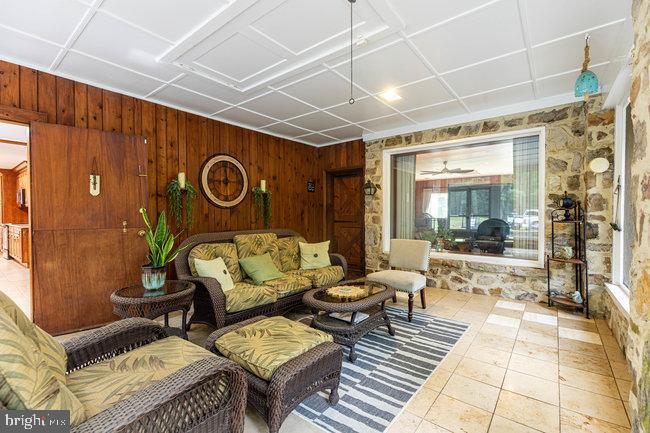 10246 Golf Course Road Fayetteville, PA 17222 - Photo 45 of 62 a living room with patio furniture and a rug