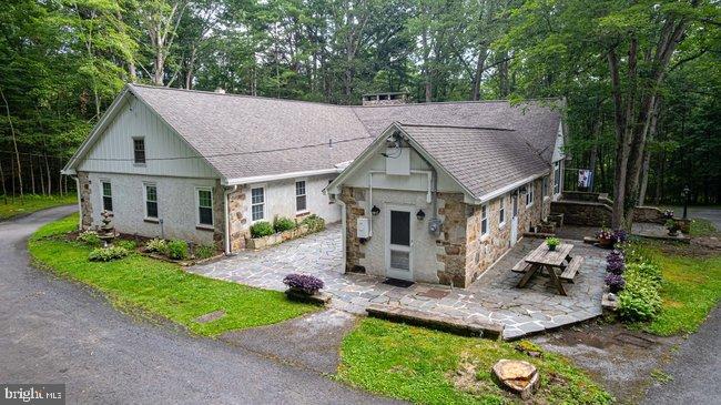 10246 Golf Course Road Fayetteville, PA 17222 - Photo 49 of 62 a house with green field in front of it